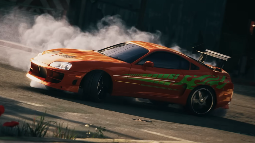 Toyota Supra arancione durante una scena d’azione di Stuntman Hollywood